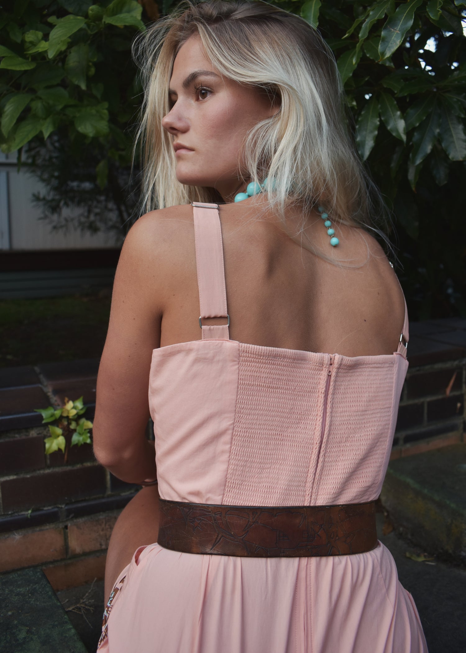 coral pink cotton playsuit with shirring back and adjustable straps beach suit romper with hula hibiscus flowers palm trees and Hawaiian girls in grass skirts dancing hand embroidered embroidery