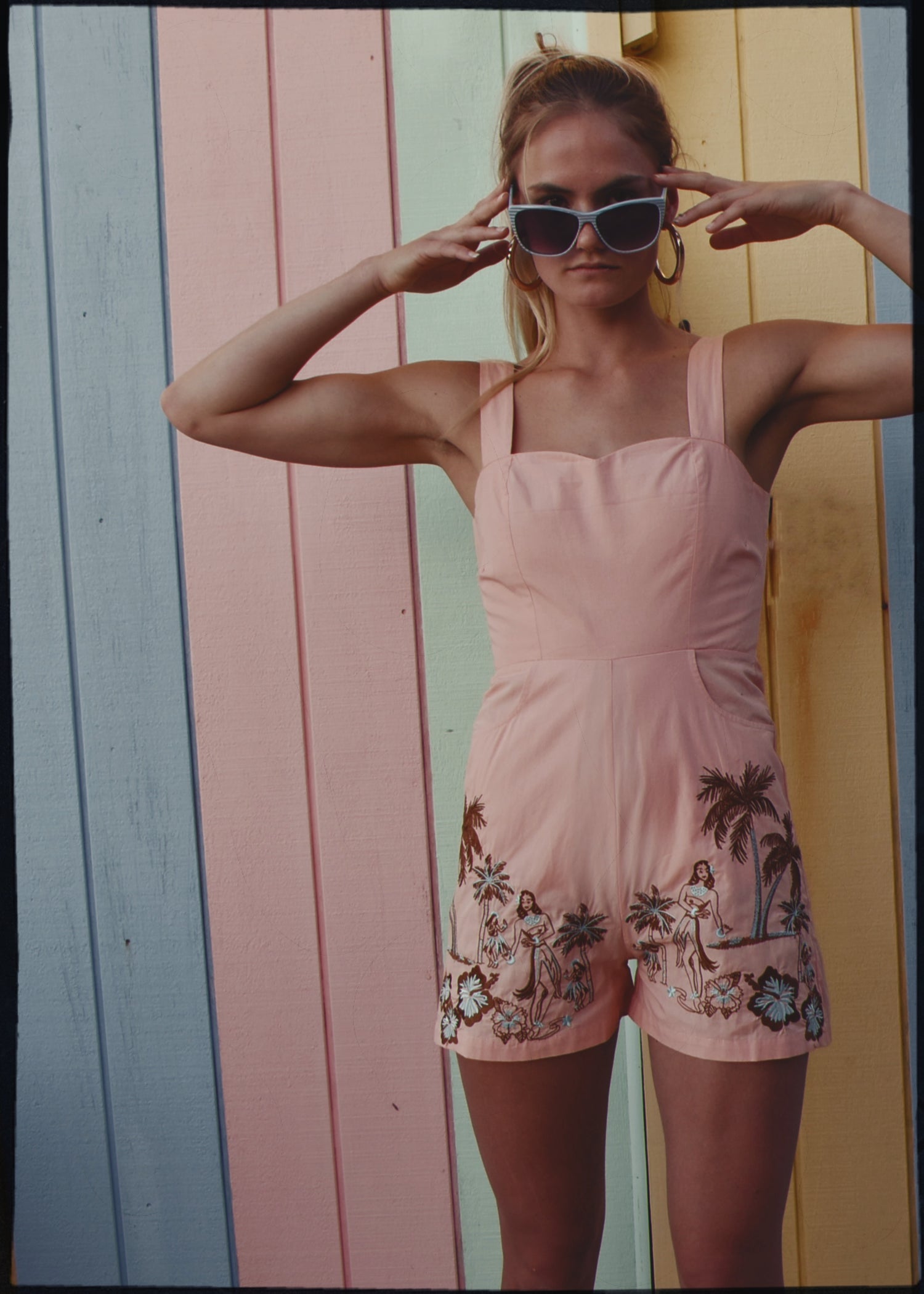 bohemian vintage retro style playsuit, beach suit bathing suit with shell buttons and pink material, hand embroidered with Hawaii tiki style hula gils and hibiscus flowers