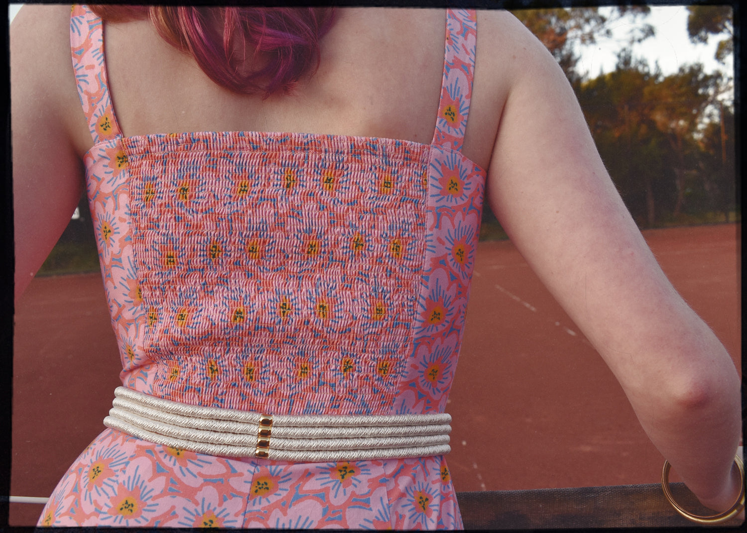 pink patterned retro style vintage playsuit, swimsuit, beach suit with shirred back and button up front