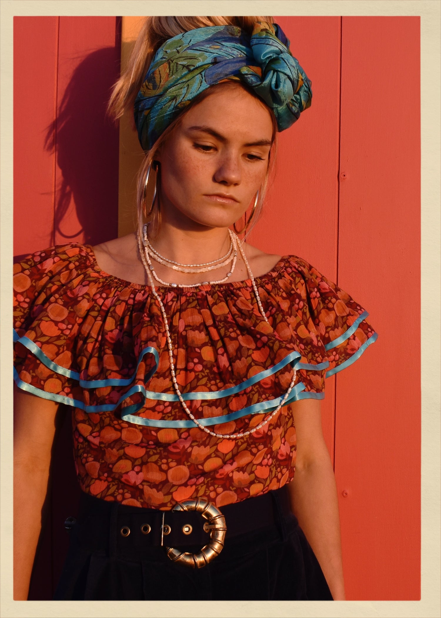 ruffle blouse top shirt warm autumn coloured printed cotton with blue satin ribbon trim. Calypso style salsa. The Outlaw Dame