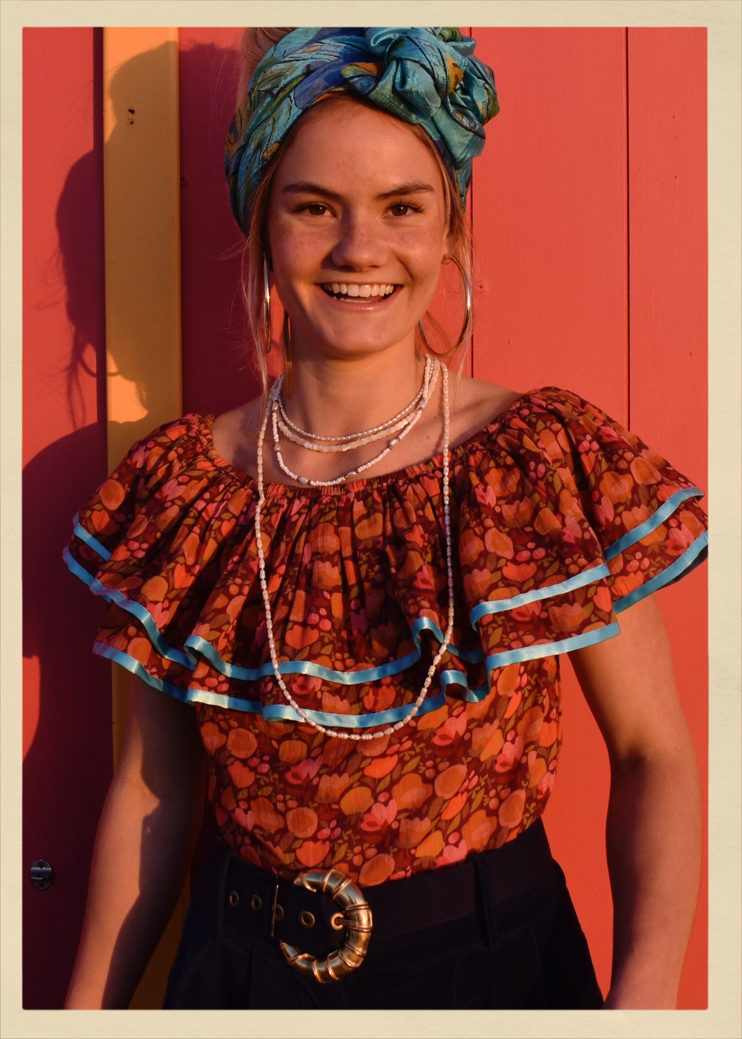 ruffle blouse top shirt warm autumn coloured printed cotton with blue satin ribbon trim. Calypso style salsa. The Outlaw Dame