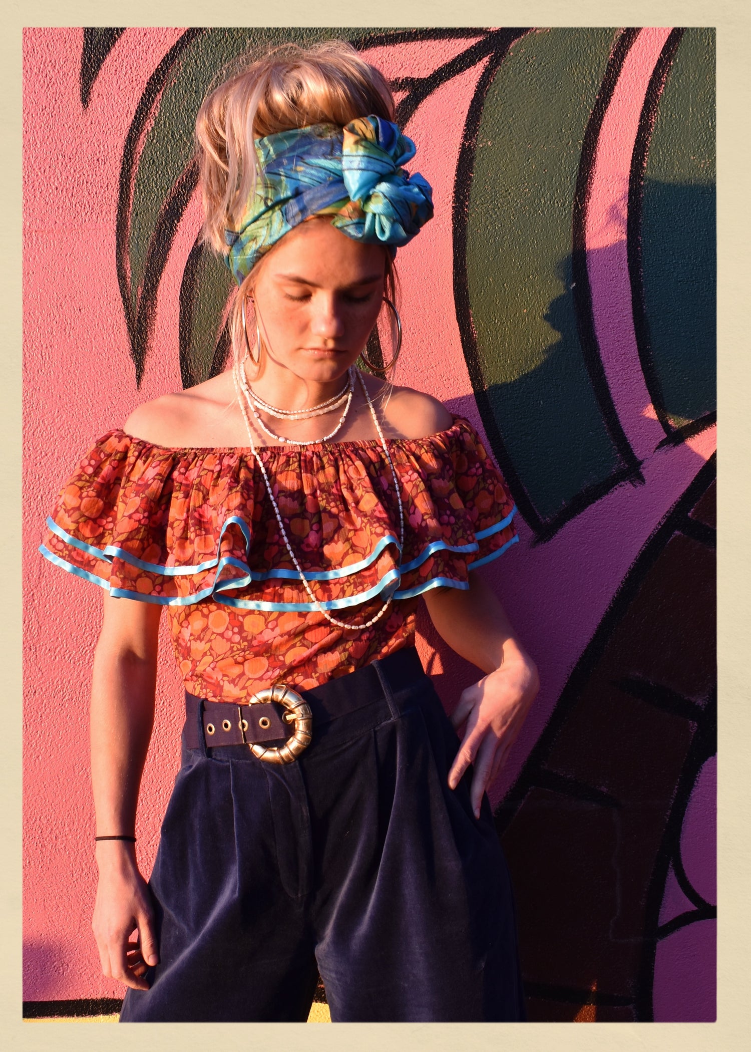 ruffle blouse top shirt warm autumn coloured printed cotton with blue satin ribbon trim. Calypso style salsa. The Outlaw Dame