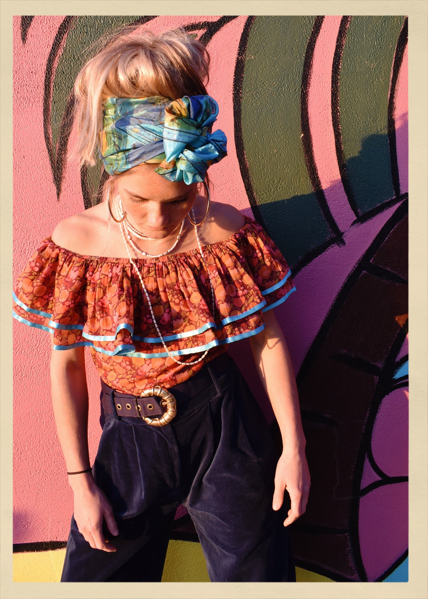 ruffle blouse top shirt warm autumn coloured printed cotton with blue satin ribbon trim. Calypso style salsa. The Outlaw Dame