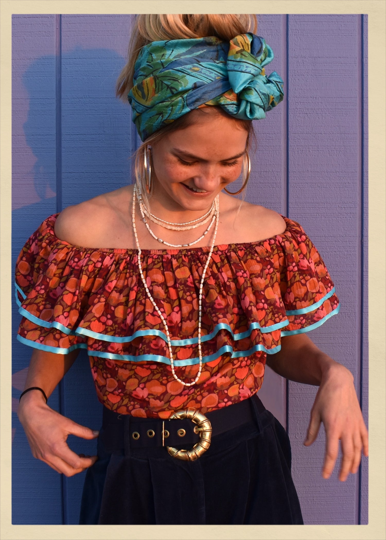 ruffle blouse top shirt warm autumn coloured printed cotton with blue satin ribbon trim. Calypso style salsa. The Outlaw Dame