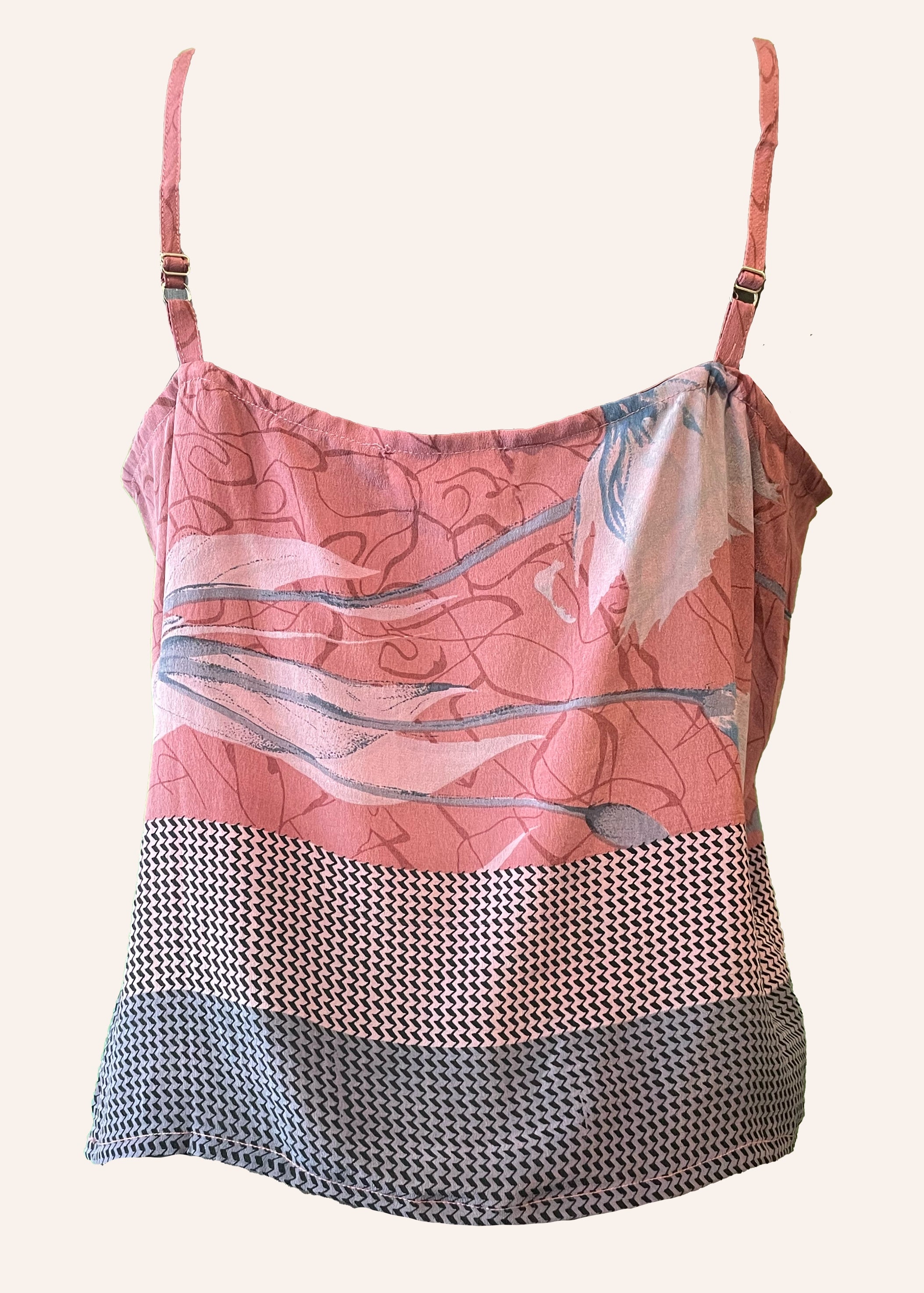 Pink and gray patterned top with thin straps on a white background