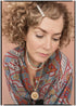 Woman wearing a bohemian style balloon sleeved patterned blouse made from vintage repurposed Indian silk crepe sari in front of a plain background