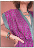 Woman wearing a bohemian style balloon sleeved patterned blouse made from vintage repurposed Indian silk crepe sari in front of a plain background