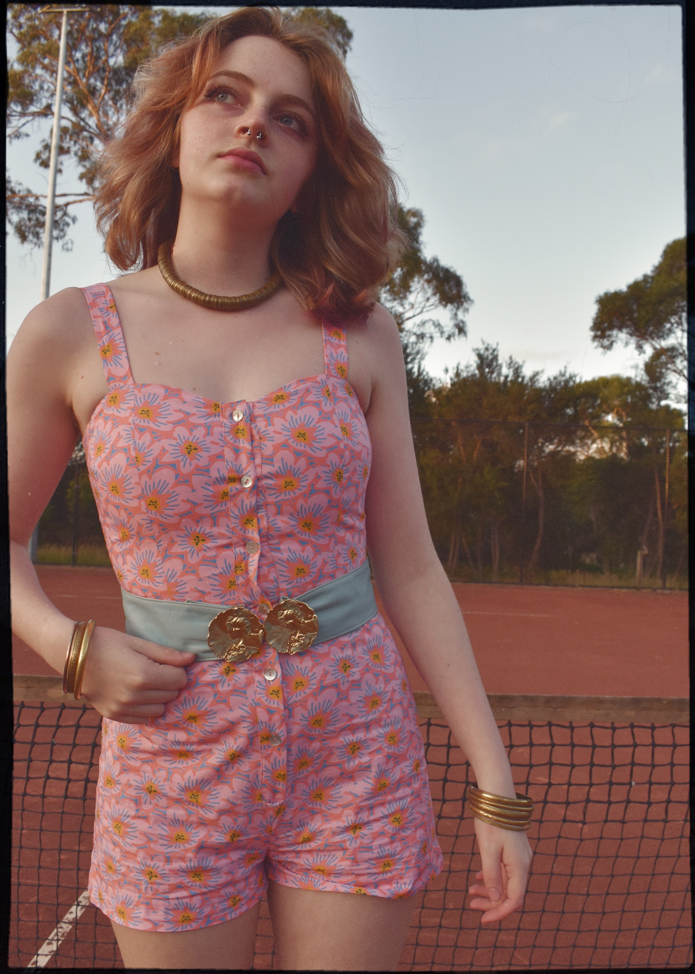 pink patterned retro style vintage playsuit, swimsuit, beach suit with shirred back and button up front